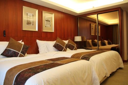 Imagen de la habitación del Hotel Xi'an Qu Jiang Yin Zuo. Foto 11