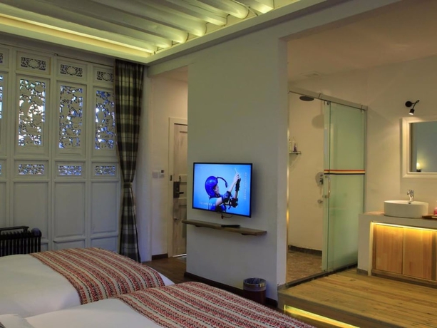Imagen de la habitación del Hotel Xianyun Xiyue Boutique Holiday Hotel. Foto 10