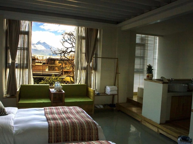 Imagen de la habitación del Hotel Xianyun Xiyue Boutique Holiday Hotel. Foto 11