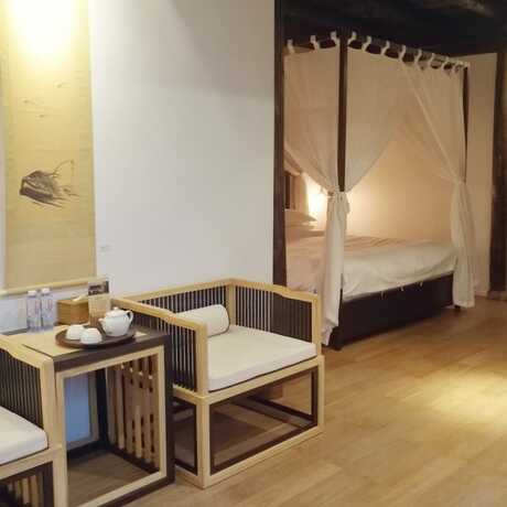 Imagen de la habitación del Hotel Xiaochaguniang Minsu. Foto 13