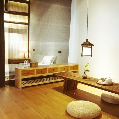 Imagen de la habitación del Hotel Xiaochaguniang Minsu. Foto 18