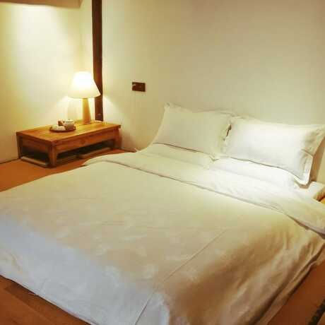 Imagen de la habitación del Hotel Xiaochaguniang Minsu. Foto 21