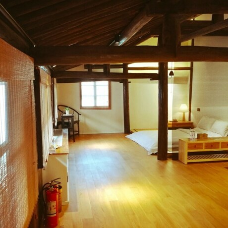 Imagen de la habitación del Hotel Xiaochaguniang Minsu. Foto 26