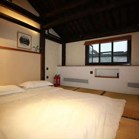 Imagen de la habitación del Hotel Xiaochaguniang Minsu. Foto 27