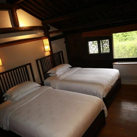 Imagen de la habitación del Hotel Xiaochaguniang Minsu. Foto 29