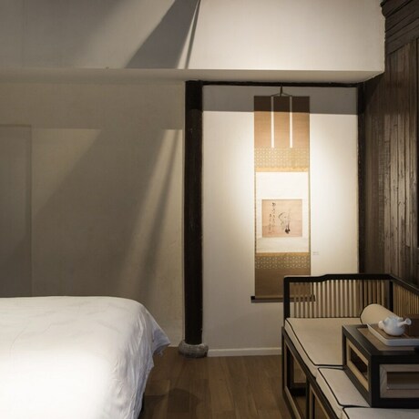 Imagen de la habitación del Hotel Xiaochaguniang Minsu. Foto 30