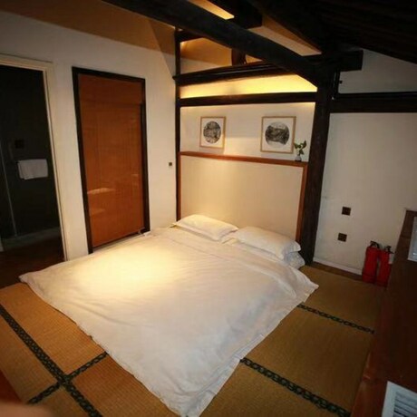 Imagen de la habitación del Hotel Xiaochaguniang Minsu. Foto 33
