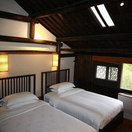 Imagen de la habitación del Hotel Xiaochaguniang Minsu. Foto 34