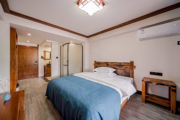 Imagen de la habitación del Hotel Xijiang Village Vision. Foto 5