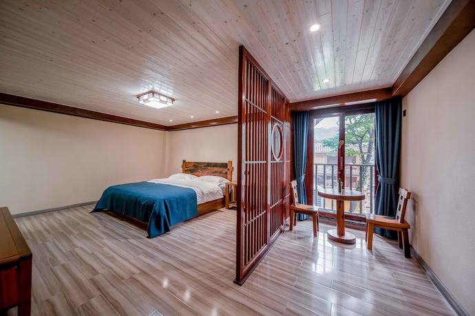 Imagen de la habitación del Hotel Xijiang Village Vision. Foto 16