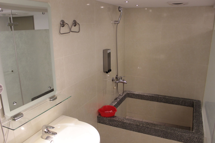 Imagen de la habitación del Hotel Ximen 135 house. Foto 2