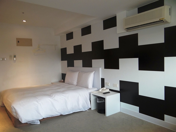 Imagen de la habitación del Hotel Ximen 135 house. Foto 12