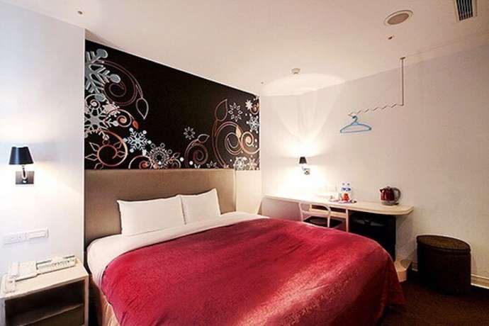 Imagen de la habitación del Hotel Ximen. Foto 11