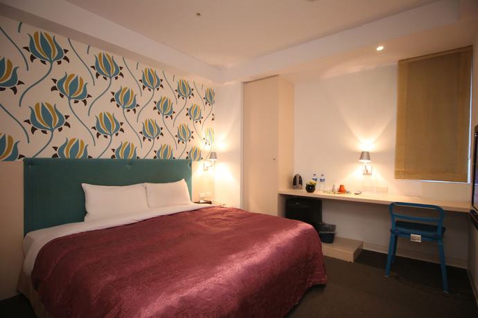 Imagen de la habitación del Hotel Ximen. Foto 12