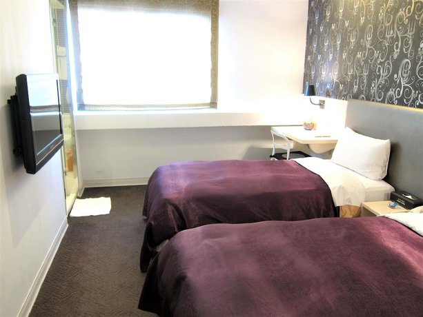 Imagen de la habitación del Hotel Ximen. Foto 17