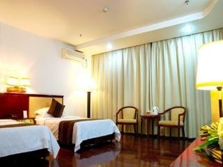 Imagen de la habitación del Hotel Xin Gang Holiday. Foto 8