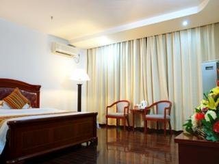 Imagen de la habitación del Hotel Xin Gang Holiday. Foto 9