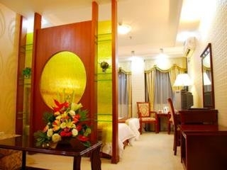 Imagen de la habitación del Hotel Xin Gang Holiday. Foto 10