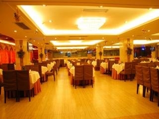 Imagen del bar/restaurante del Hotel Xin Gang Holiday. Foto 3