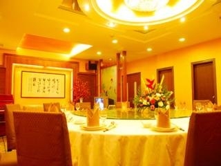 Imagen del bar/restaurante del Hotel Xin Gang Holiday. Foto 6