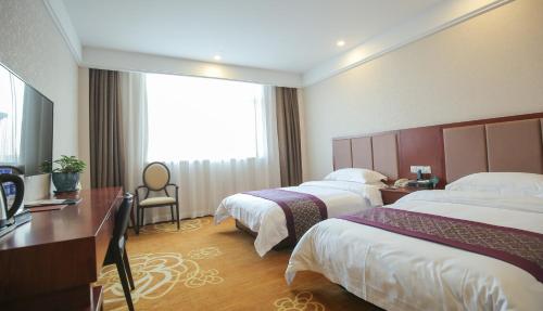 Imagen de la habitación del Hotel Xin Jue Jiayi. Foto 9