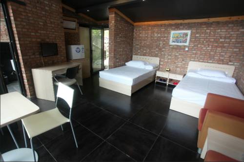 Imagen de la habitación del Hotel Xin Shuang Quan Resort. Foto 1