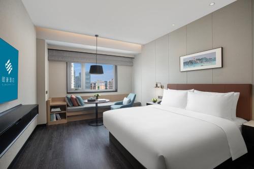 Imagen de la habitación del Hotel Xin\'an Yihao - Xiamen Railway Station Mixc City Store. Foto 16