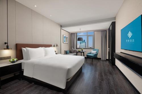 Imagen de la habitación del Hotel Xin\'an Yihao - Xiamen Railway Station Mixc City Store. Foto 18