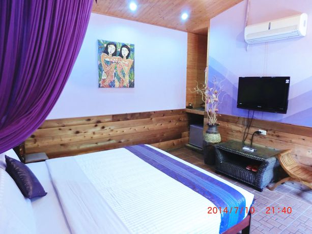 Imagen de la habitación del Hotel Xing Ji Bungalow. Foto 4