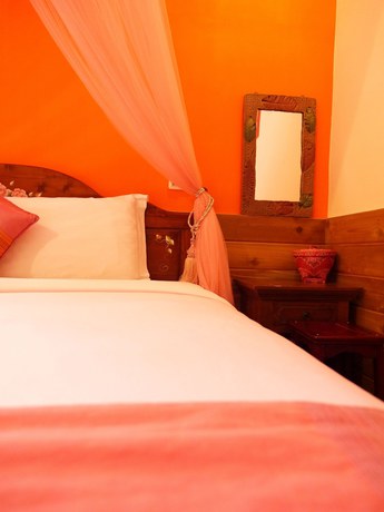 Imagen de la habitación del Hotel Xing Ji Bungalow. Foto 5