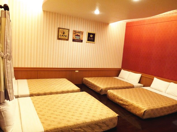 Imagen de la habitación del Hotel Xing Ji Bungalow. Foto 7