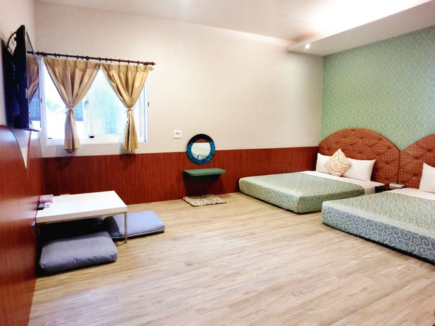 Imagen de la habitación del Hotel Xing Ji Bungalow. Foto 8