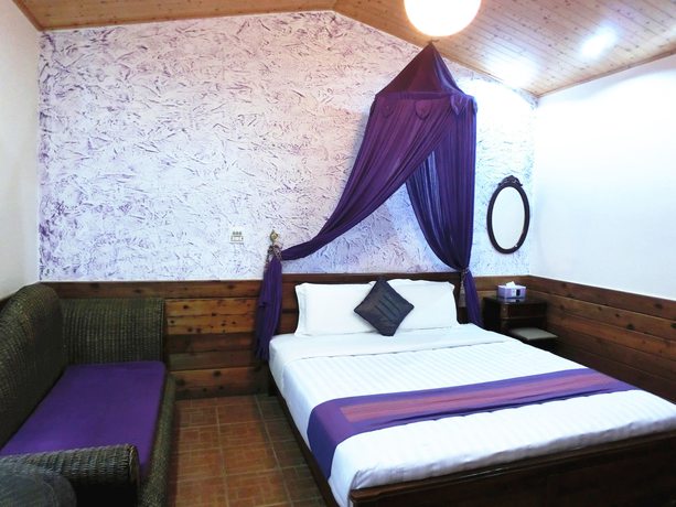 Imagen de la habitación del Hotel Xing Ji Bungalow. Foto 9