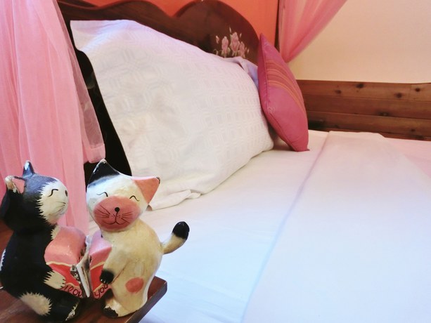 Imagen de la habitación del Hotel Xing Ji Bungalow. Foto 10