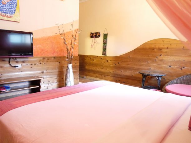 Imagen de la habitación del Hotel Xing Ji Bungalow. Foto 11