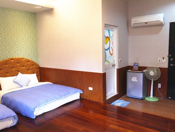 Imagen de la habitación del Hotel Xing Ji Bungalow. Foto 14