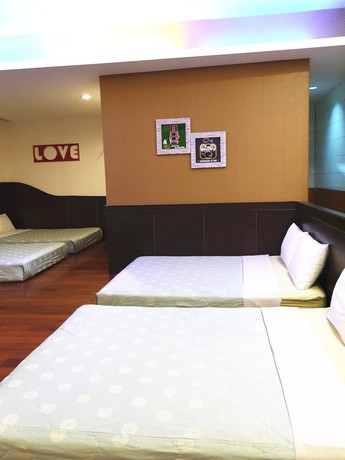 Imagen de la habitación del Hotel Xing Ji Bungalow. Foto 17
