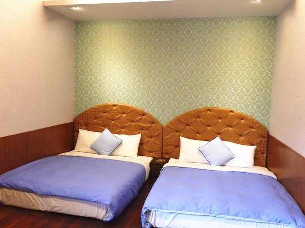 Imagen de la habitación del Hotel Xing Ji Bungalow. Foto 20