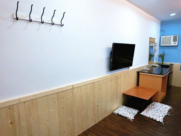 Imagen de la habitación del Hotel Xing Ji. Foto 22