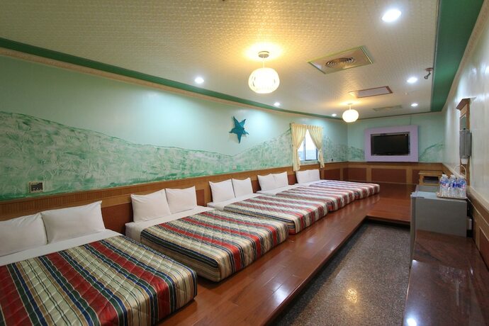 Imagen de la habitación del Hotel Xing Ji. Foto 27