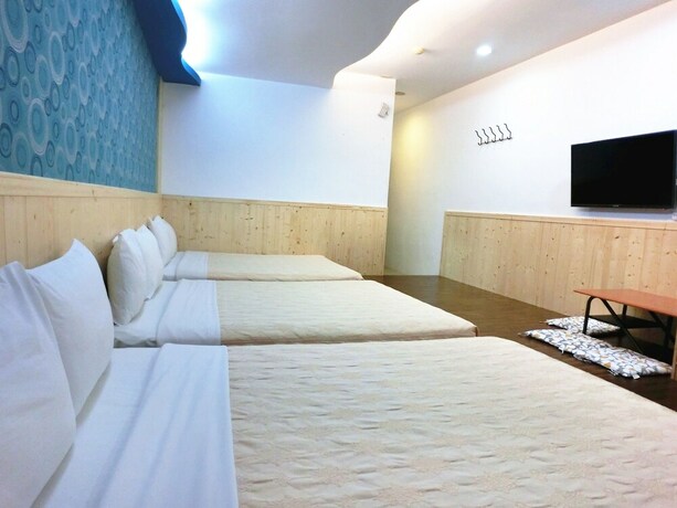Imagen de la habitación del Hotel Xing Ji. Foto 28