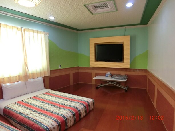Imagen de la habitación del Hotel Xing Ji. Foto 35