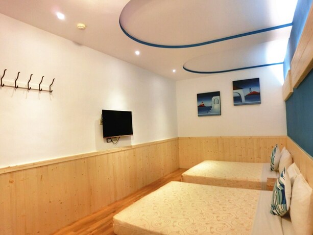 Imagen de la habitación del Hotel Xing Ji. Foto 38