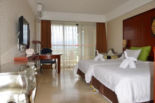 Imagen de la habitación del Hotel Xing Long Old Ban Yan Resort & Spa. Foto 7