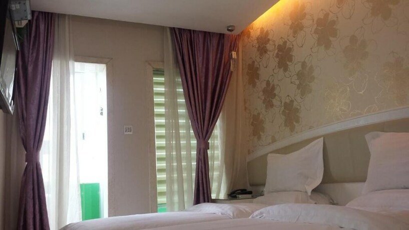 Imagen de la habitación del Hotel Xinghe Xinfeng - Railway Station. Foto 2