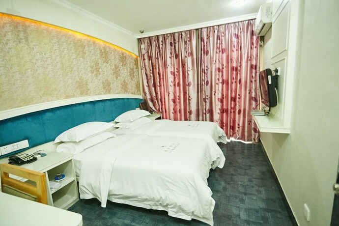 Imagen de la habitación del Hotel Xinghe Xinfeng - Railway Station. Foto 3