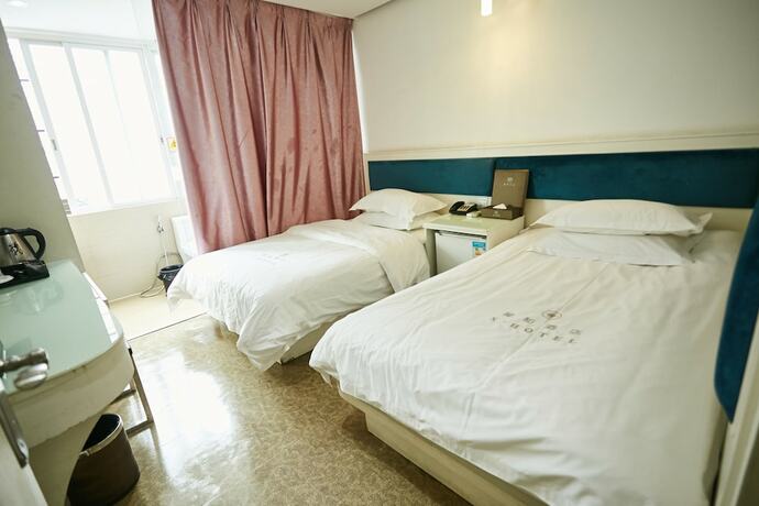 Imagen de la habitación del Hotel Xinghe Xinfeng - Railway Station. Foto 4