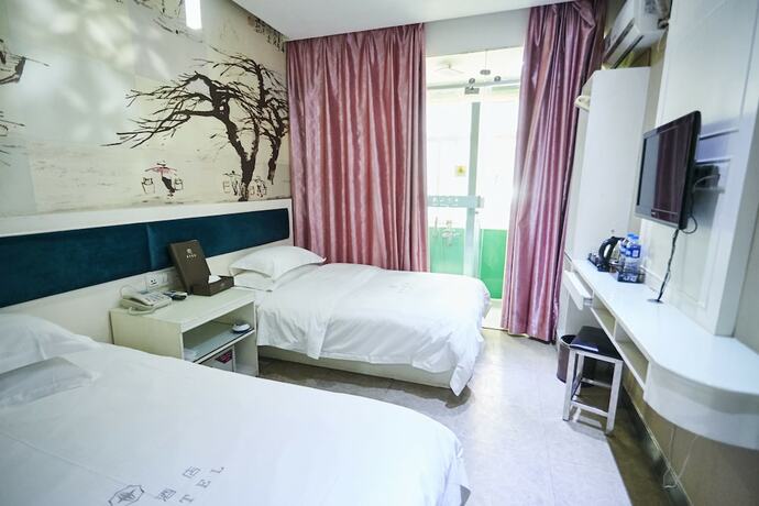 Imagen de la habitación del Hotel Xinghe Xinfeng - Railway Station. Foto 9