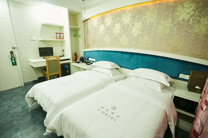 Imagen de la habitación del Hotel Xinghe Xinfeng - Railway Station. Foto 10