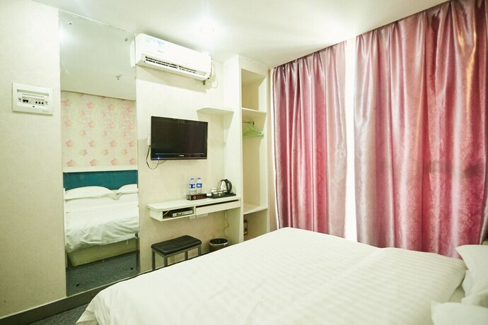 Imagen de la habitación del Hotel Xinghe Xinfeng - Railway Station. Foto 12